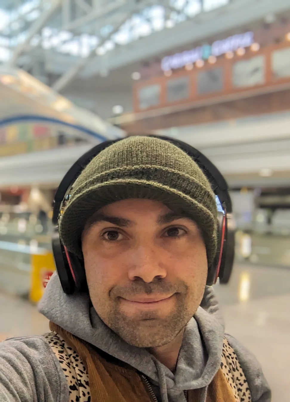 Ryan Mott wearing headphones and a knit cap